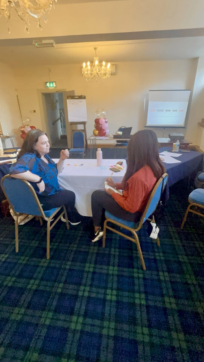 Two participants listening and responding to each other during a communication activity