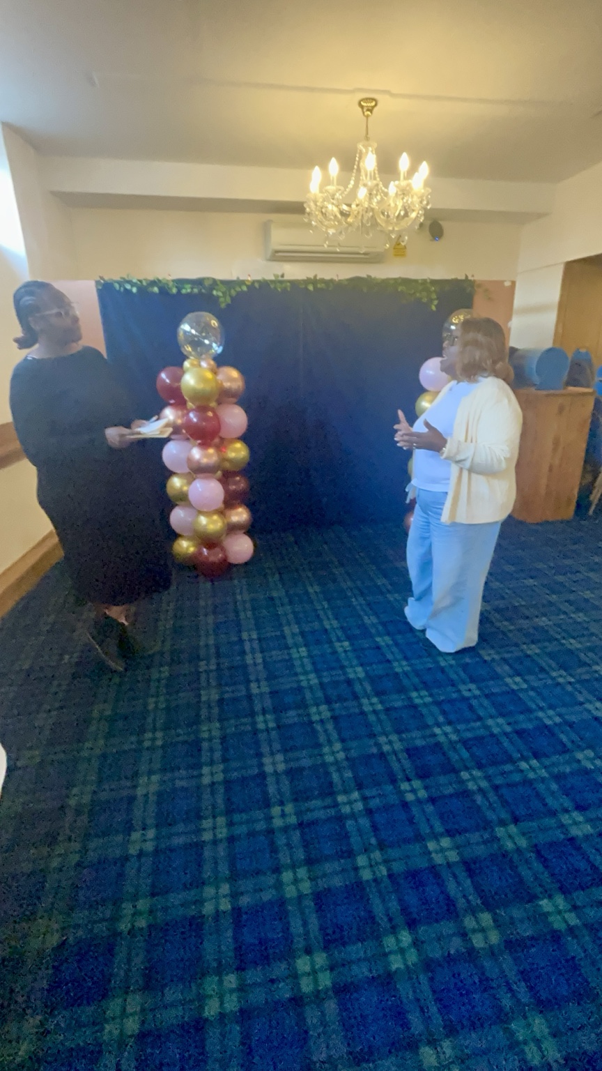 Charmaine practising speaking while a fellow participant listens