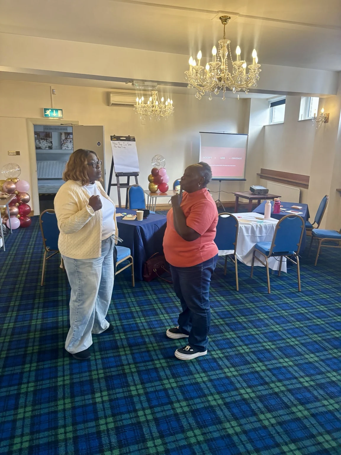 Two participants practising a communication activity together